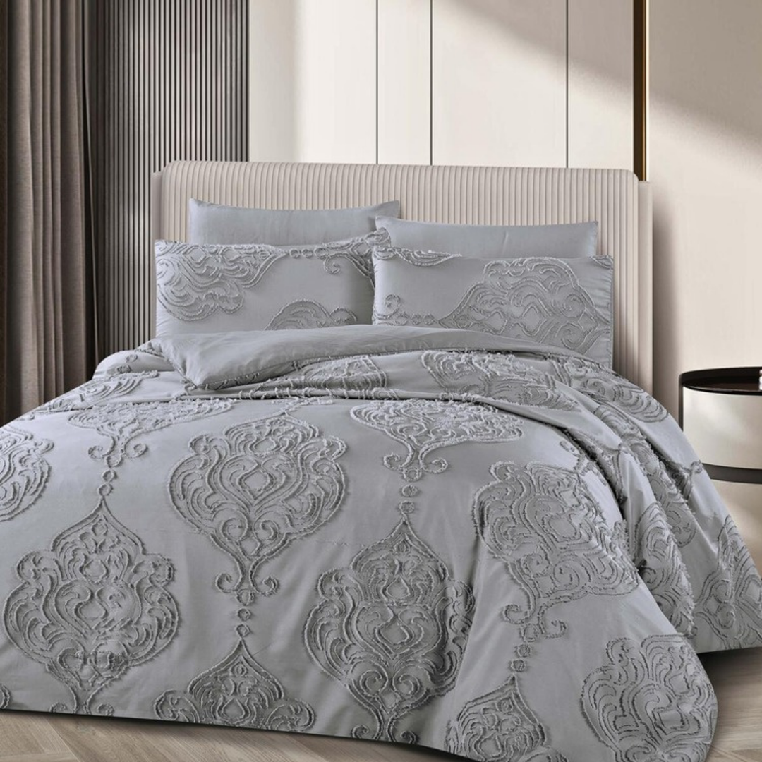 Grey duvet cover with raised damask pattern and matching pillowcases