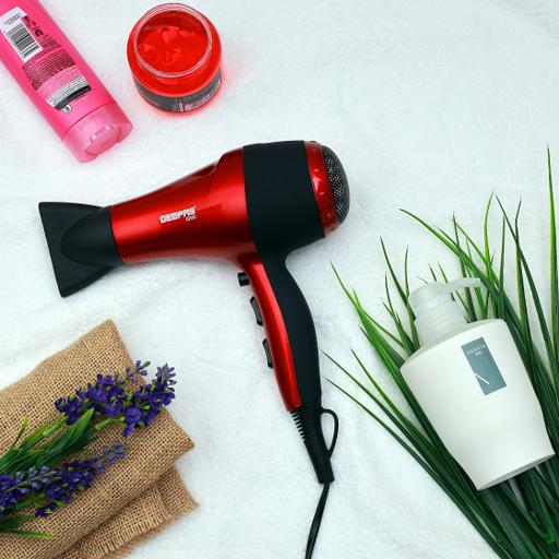 Electric hair dryer with concentrator nozzle and ergonomic handle