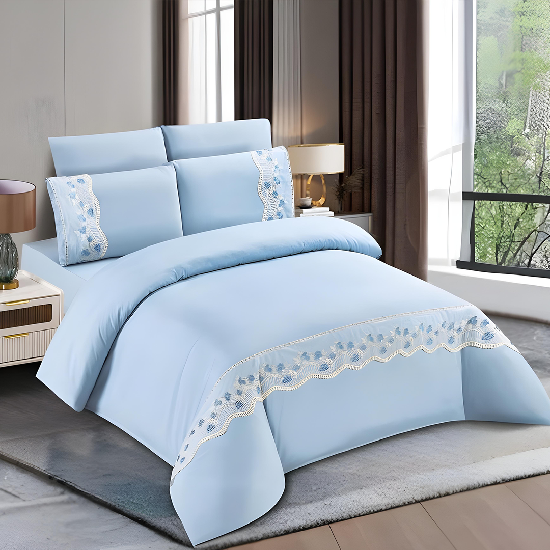 Light blue bedding set with lace trim including bedsheet, duvet cover, fitted sheet, and pillowcases
