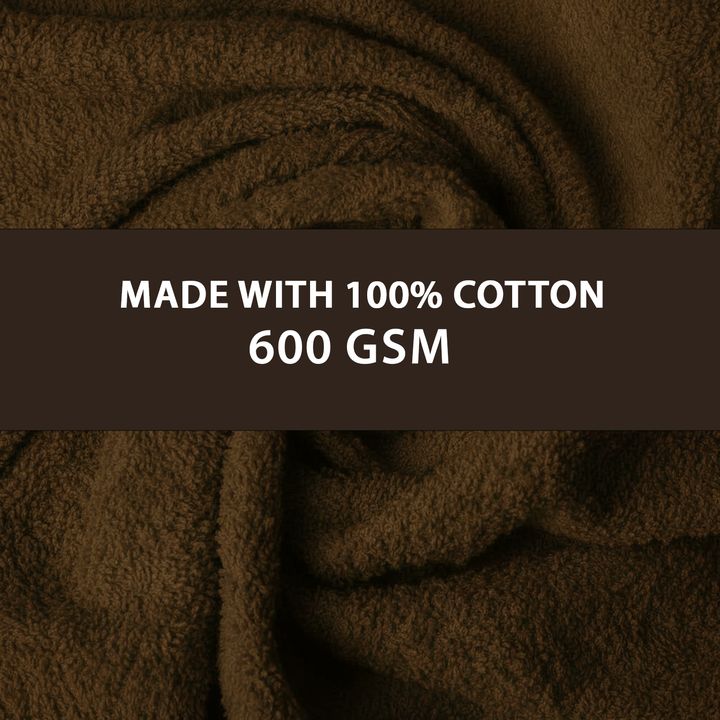 Soft brown towels rolled neatly emphasizing absorbent fabric