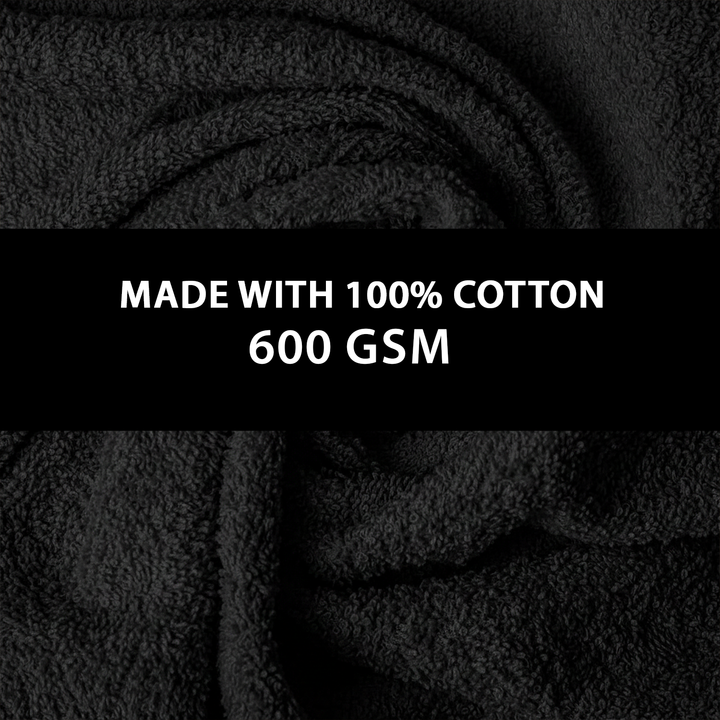 Close-up of black Towel with text indicating 100% cotton and 600 GSM.