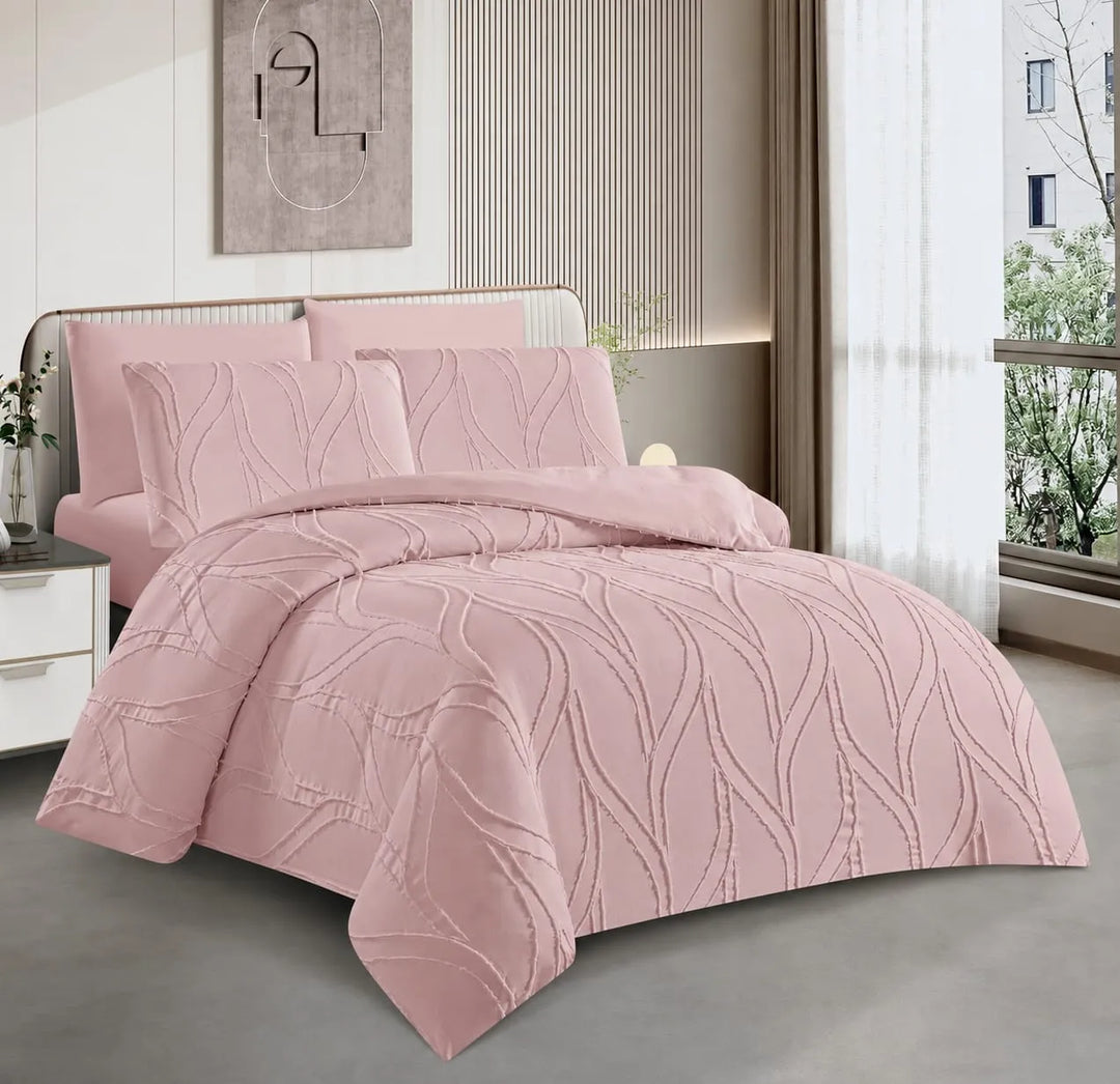A pink 200x200 duvet cover set with a textured, wavy embossed pattern, displayed on a bed in a modern bedroom setting.