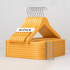 Brown wooden clothes hangers stacked with metal hooks
