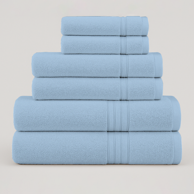 Light blue cotton bath towel set stacked to show thickness