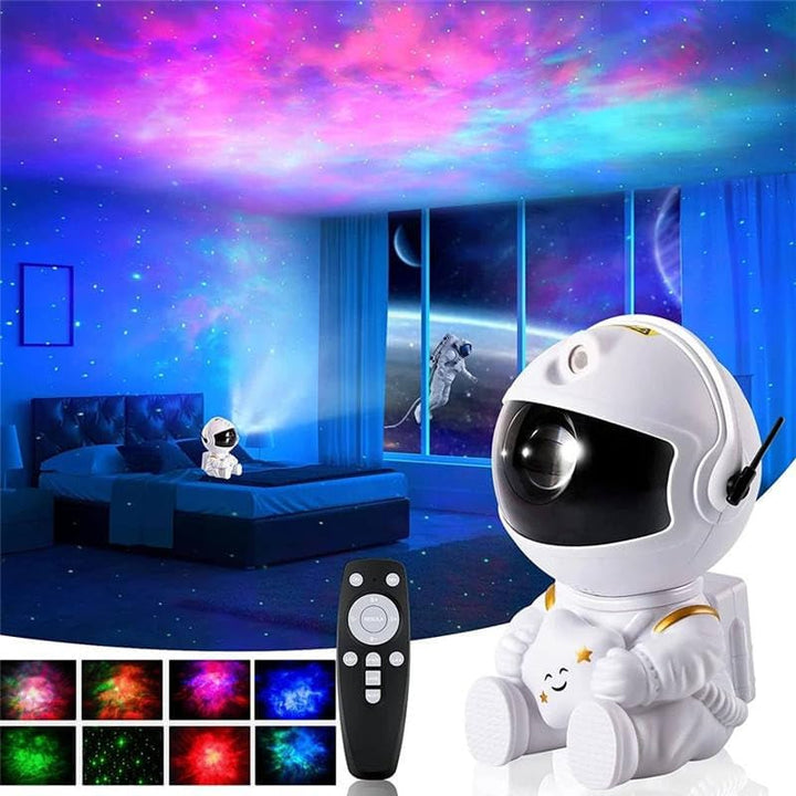 An astronaut-shaped night light projector casting colorful star and nebula patterns on room walls and ceiling, with a remote control.