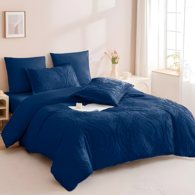 Navy blue bedding set with textured quilt cover, fitted sheet, and pillowcases