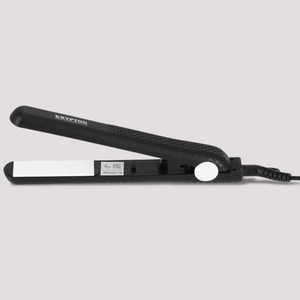 Black hair straightener with ceramic plates shown open on flat surface