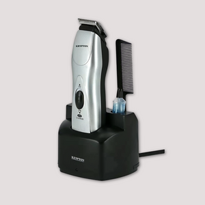 Silver cordless hair trimmer placed on charging stand with comb attachment