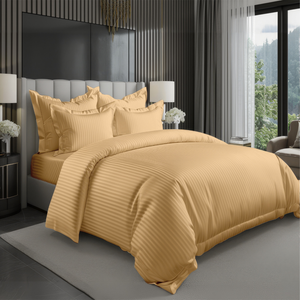 Mustard yellow striped duvet cover with fitted sheet and matching pillowcases on bed