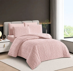 A pink tluxury bedding set
 with matching pillow shams and a duvet set.