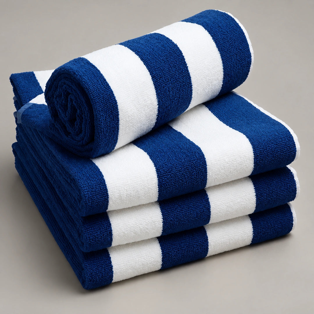 Folded navy blue and white bath towels