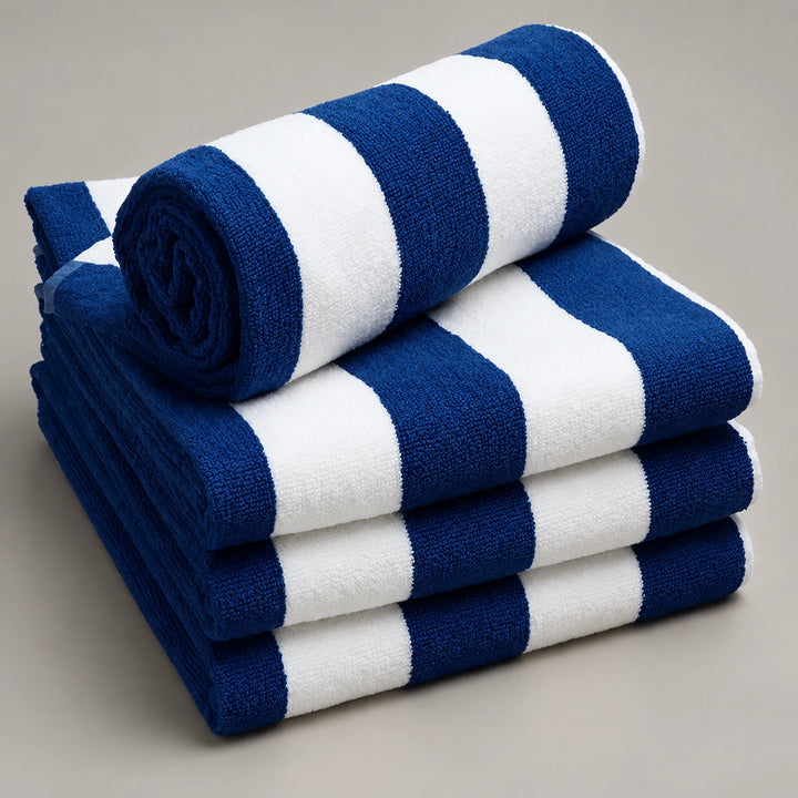 Folded navy blue and white bath towels