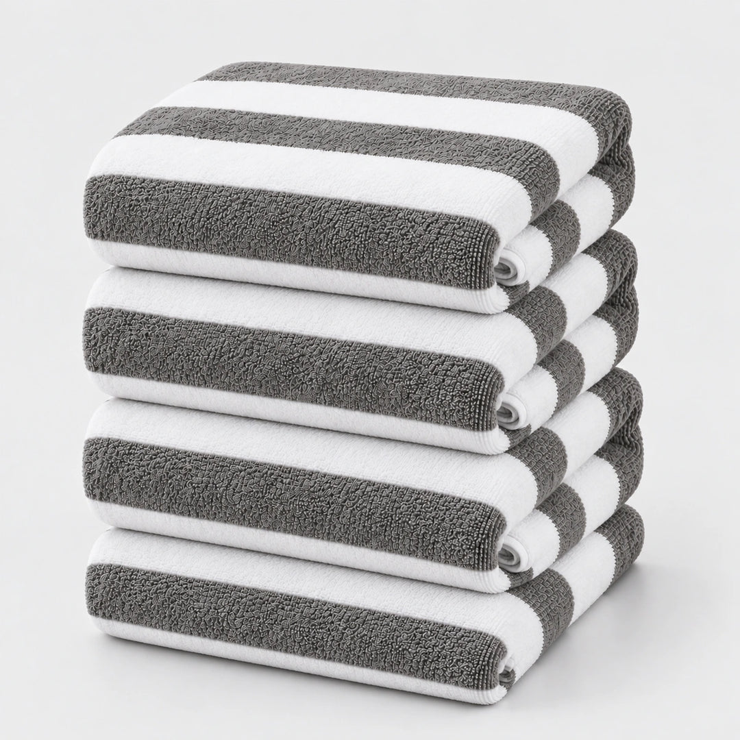Grey and white striped bath towels stacked neatly for everyday use