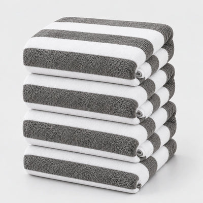 Grey and white striped bath towels stacked neatly for everyday use