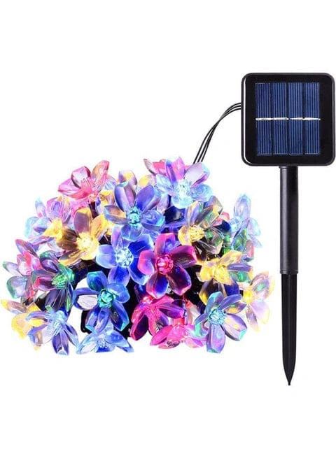 Multicolor solar light string with flower-shaped bulbs and a small black solar panel stake on a white background.