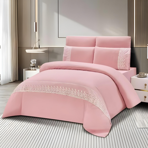 Pink bedding set with fitted sheet, quilt cover, and matching pillow covers with delicate lace detail