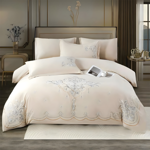Cream bedsheet set with elegant embroidered motif and matching pillow covers
