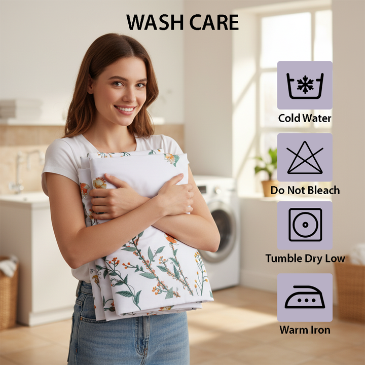 Soft white bedding styled with floral stitched bed sheet, quilt cover, and pillow cover