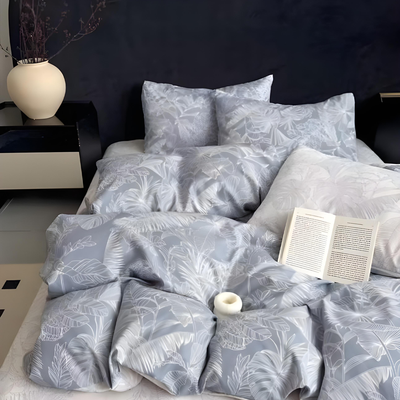 Grey floral patterned bedding set styled on a neatly made bed