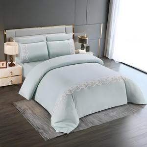 Light mint quilt cover with fitted sheet and matching pillow covers featuring lace trim