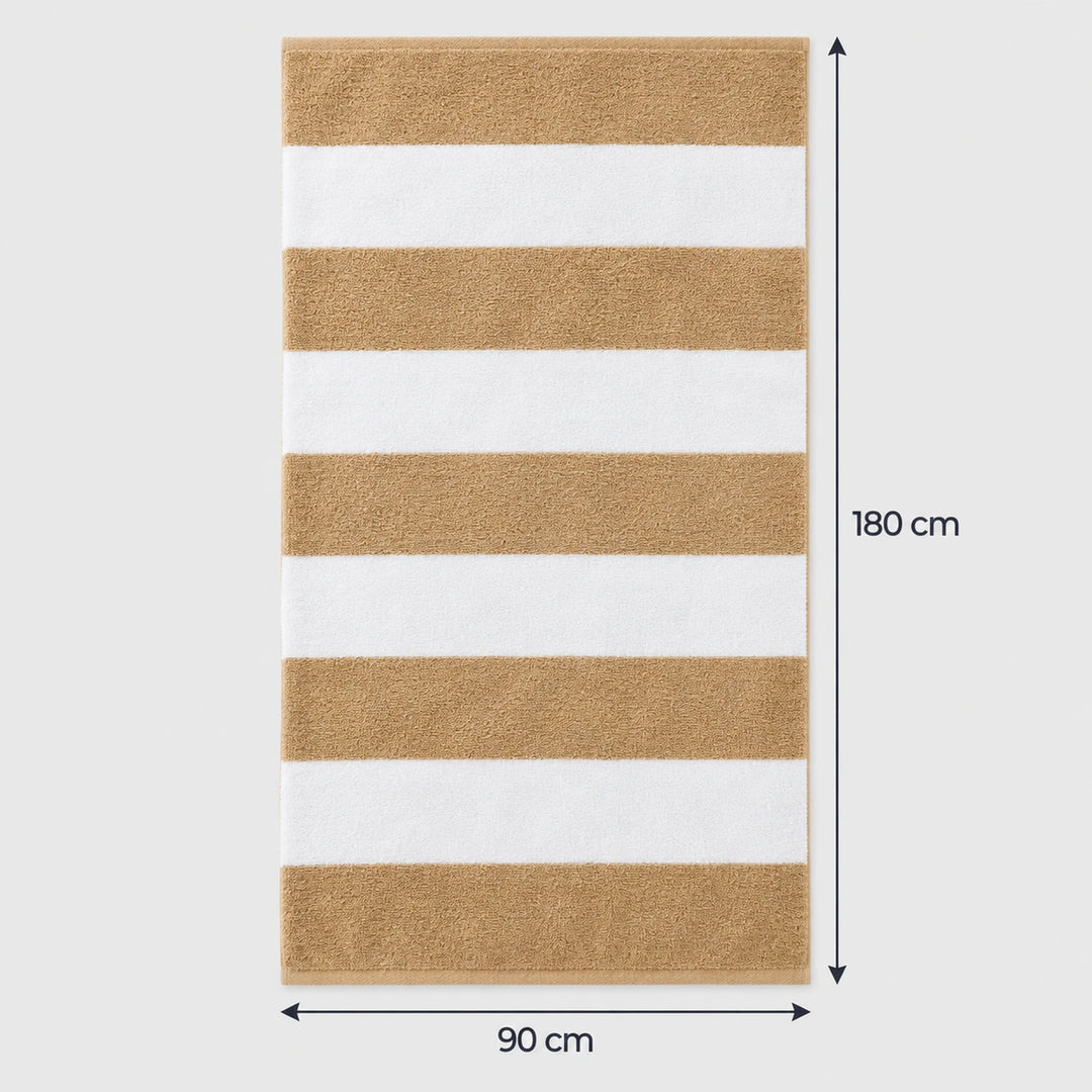 a beach picnic on beige striped towels