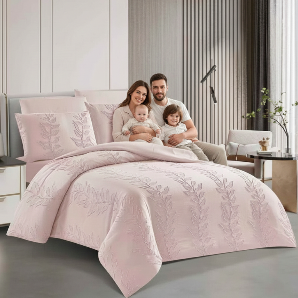 Hotel-style pink king bedspread with pillow shams