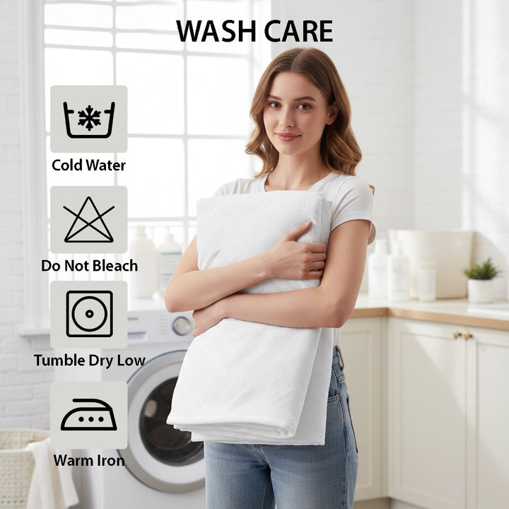 Neutral sleep setup with white quilted cover and smooth pillows