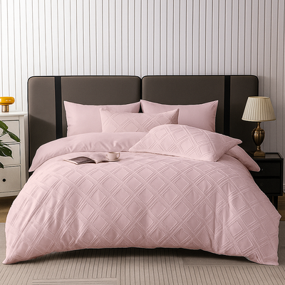 Blush pink quilted bedding set including bedsheet, duvet cover, fitted sheet, and pillowcases