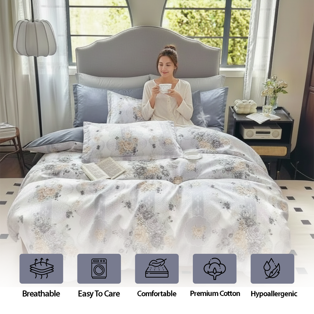 Pale patterned quilt cover arranged with blue grey cushion covers