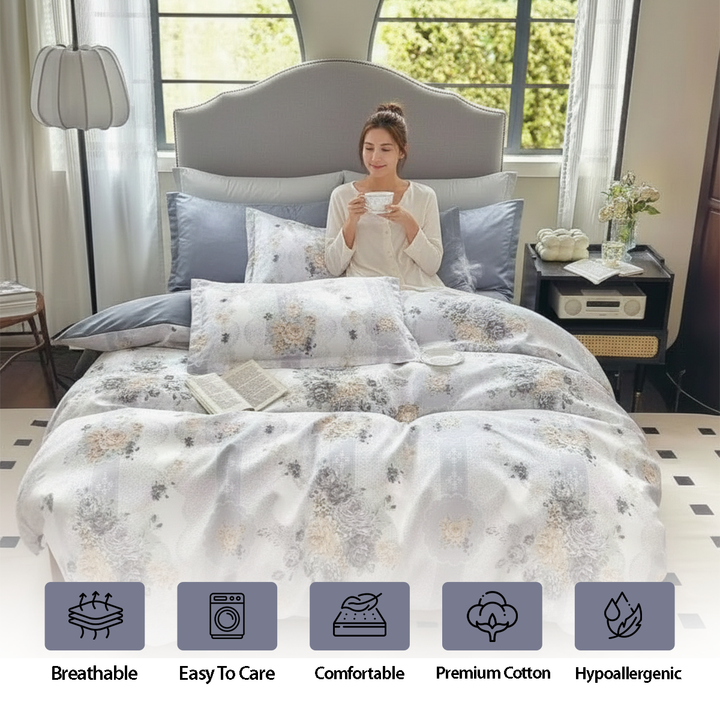 Pale patterned quilt cover arranged with blue grey cushion covers