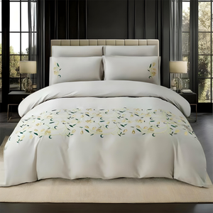 Soft white king bedding set with decorative floral detail