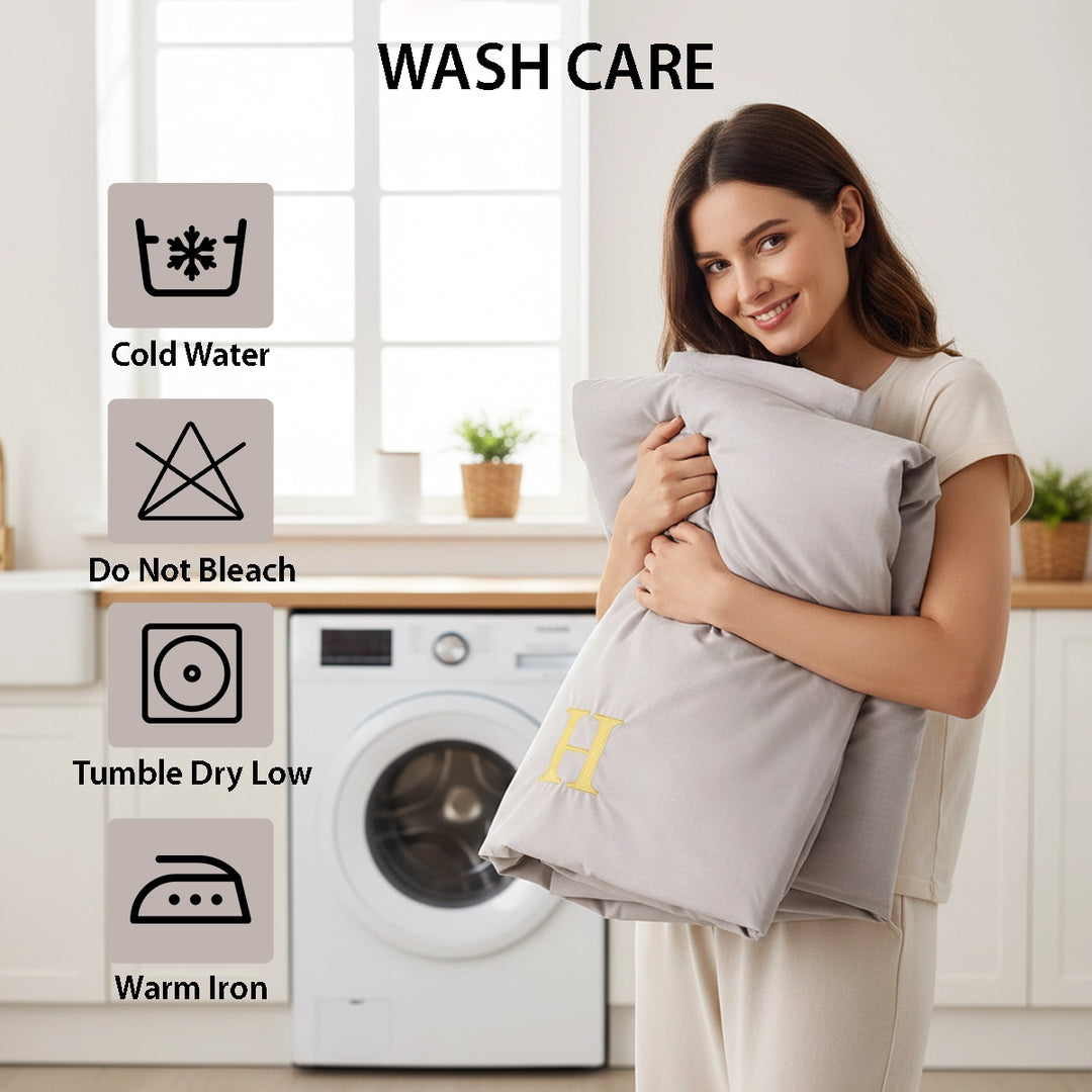 Calm sleep space styled using bed sheet, quilt cover, and pillow cover in pale grey