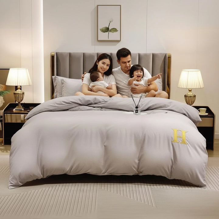 Solid grey bedding arrangement featuring bed sheet, quilt cover, and pillow cover