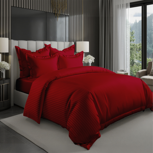 Red bedding set with striped duvet cover, fitted sheet, and pillowcases