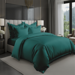 Teal green bedding set with striped duvet cover, fitted sheet, and pillowcases