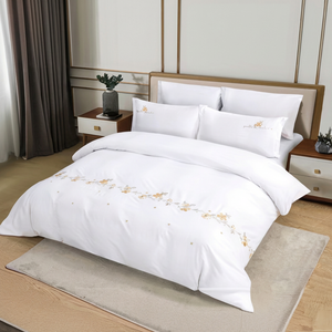 Pure white king bedding set with subtle embroidered detail
