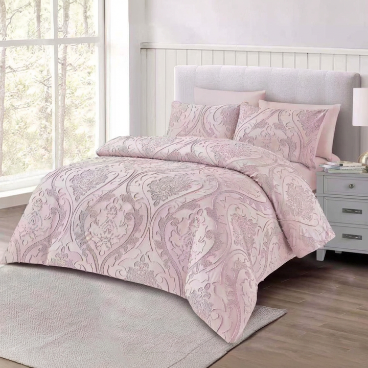 King size pink bedding set with matching pillows