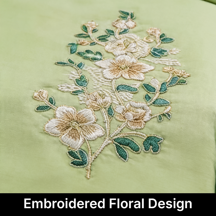 Embroidered floral design on a light green fabric in uae