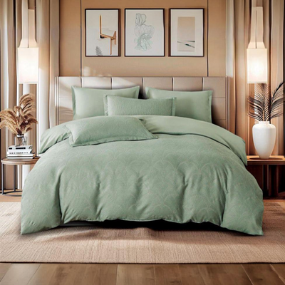 Sage green bedsheet set with subtle textured pattern and matching pillow covers