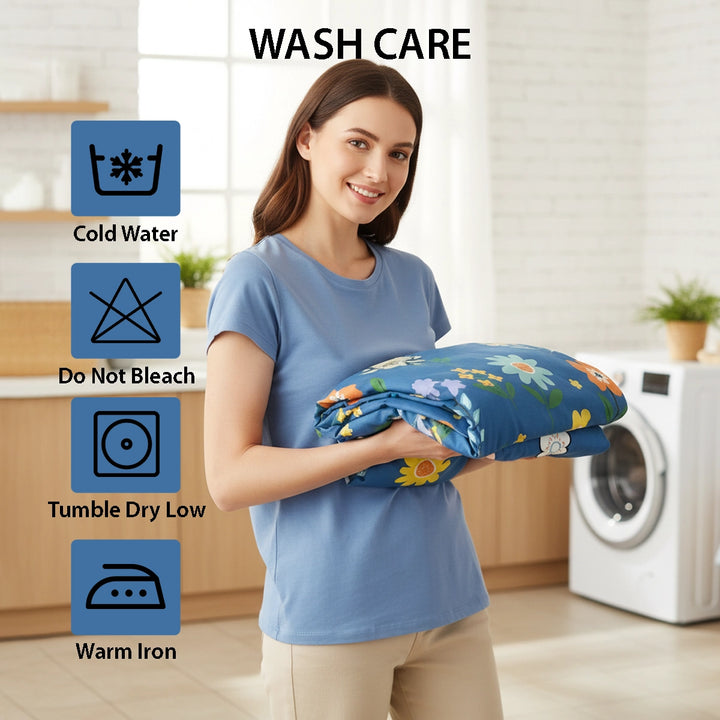 Bed dressed in blue flower pattern bed sheet with quilt cover and pillow cover