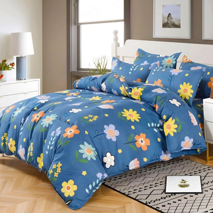 Blue floral bed sheet paired with matching quilt cover and pillow cover on bed
