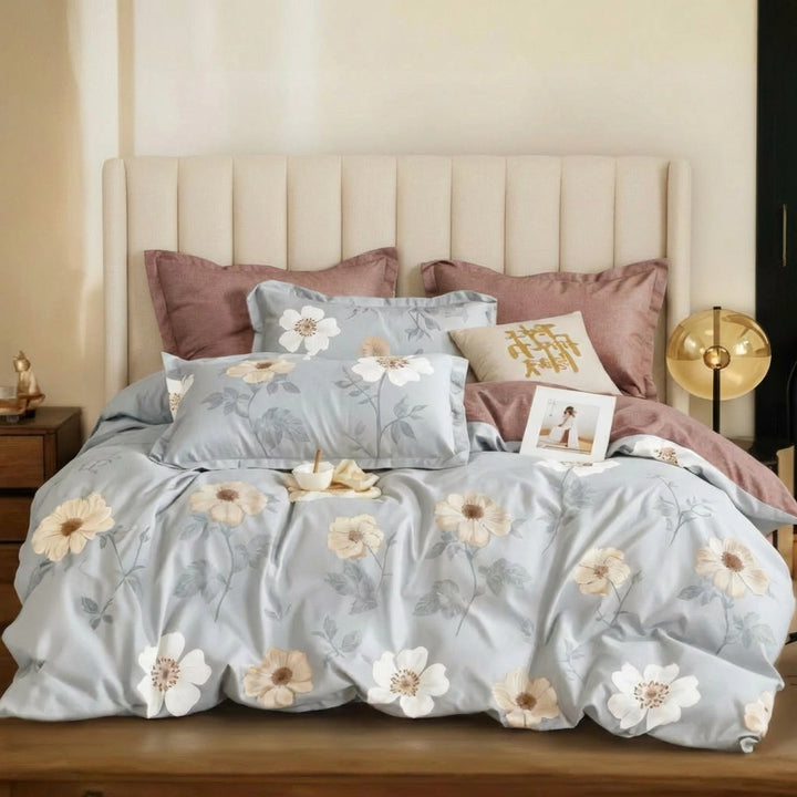 Floral bedding with bed sheet, quilt cover, and pillow cover in soft blue and beige tones
