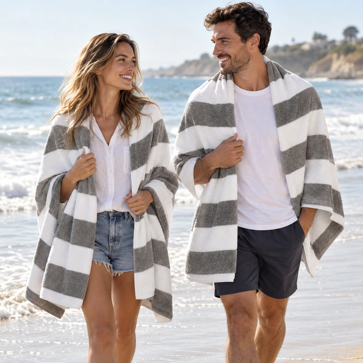 pool with grey and white striped beach towels