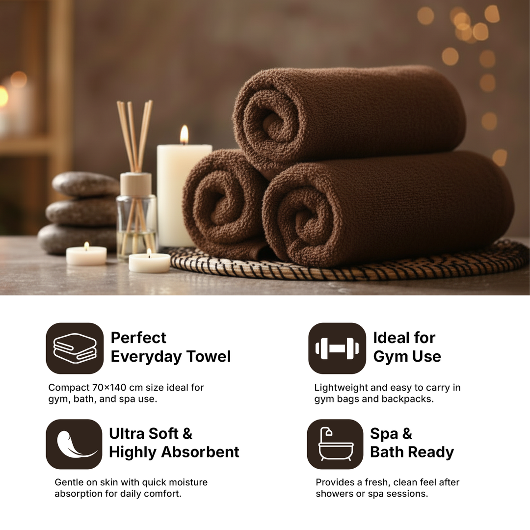 Close-up of rolled brown towels highlighting thick fabric and softness