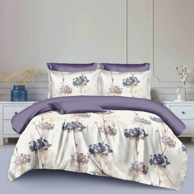 A king-sized bed with a purple duvet cover and a set of six pillowcases with a floral design. 