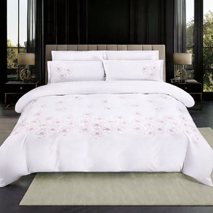 White embroidered king size bedding set with floral design