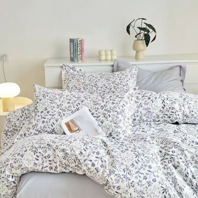 Floral printed bedding set with quilt cover, bed sheet, and pillow covers on bed