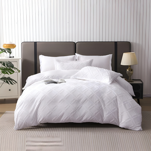 White quilt cover with fitted sheet and matching pillow covers featuring diamond texture