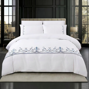 White king bedding set with artistic blue embroidery design uae