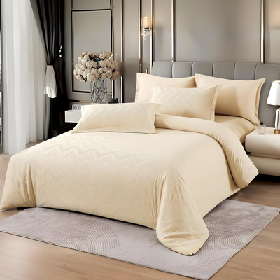 Cream bedding set with fitted sheet, quilt cover, and matching pillow covers, neatly styled on a bed